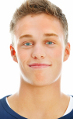 Closeup portrait of a smiling young guy isolated on white background