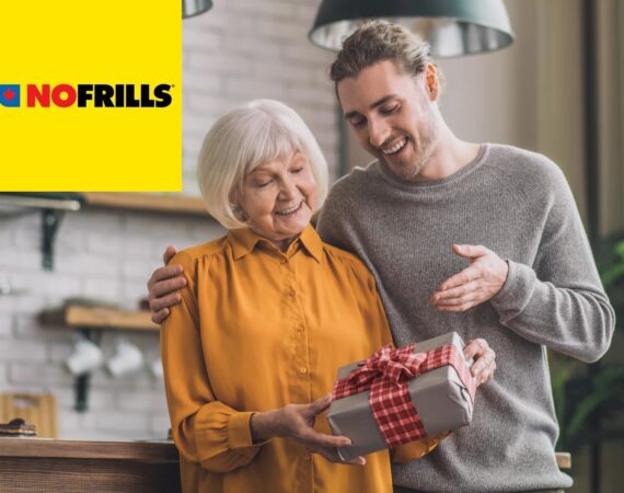 A young man is happily giving his mother a nicely wrapped gift. There's a yellow "No Frills" logo in the upper left corner.